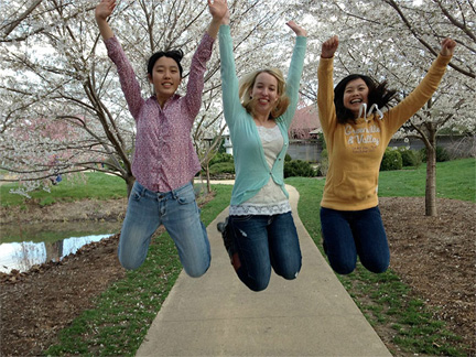 three girls jumping